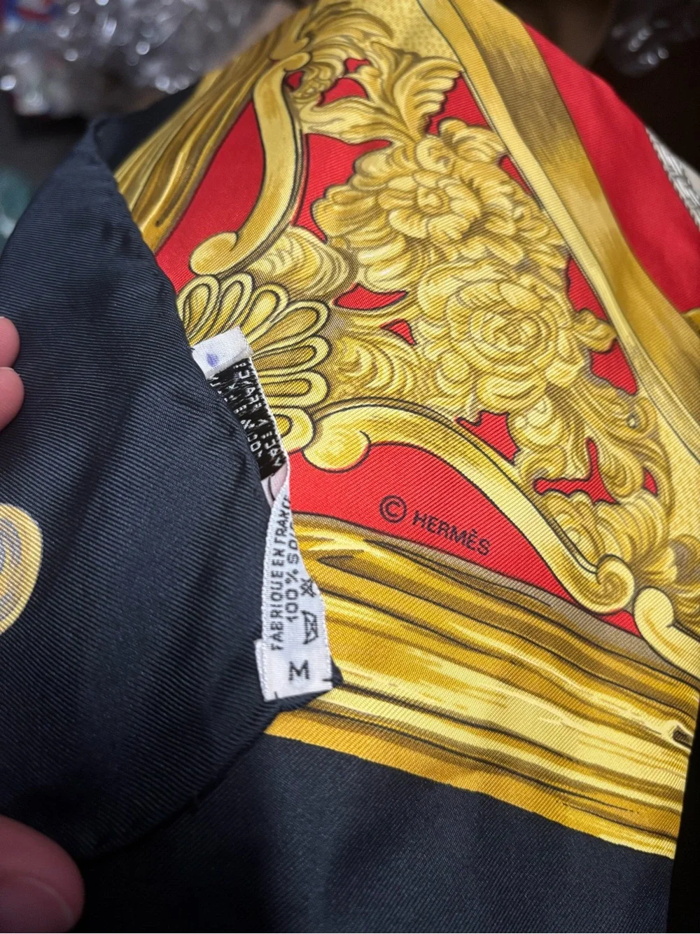 Hermès silk scarf in gold, red and black ornate print